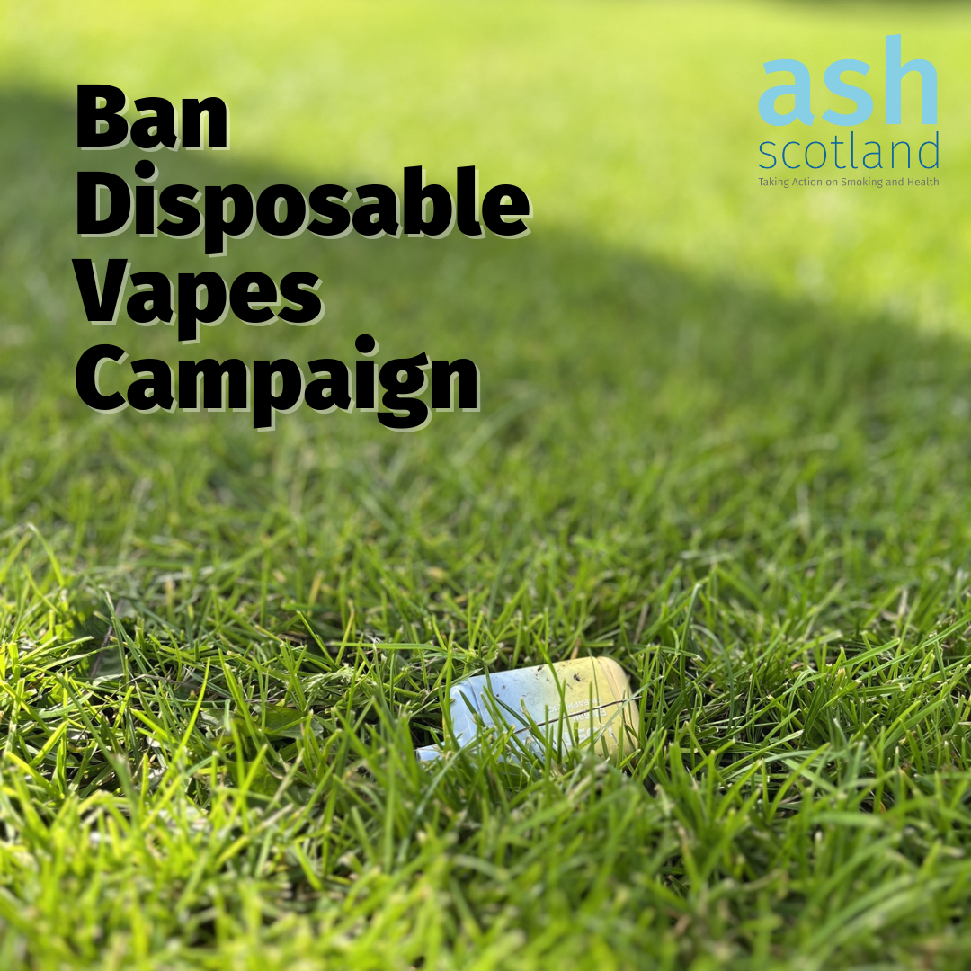 A blue and yellow disposable vape thrown in long grass with the words "Ban Disposable Vapes Campaign" in the top left corner